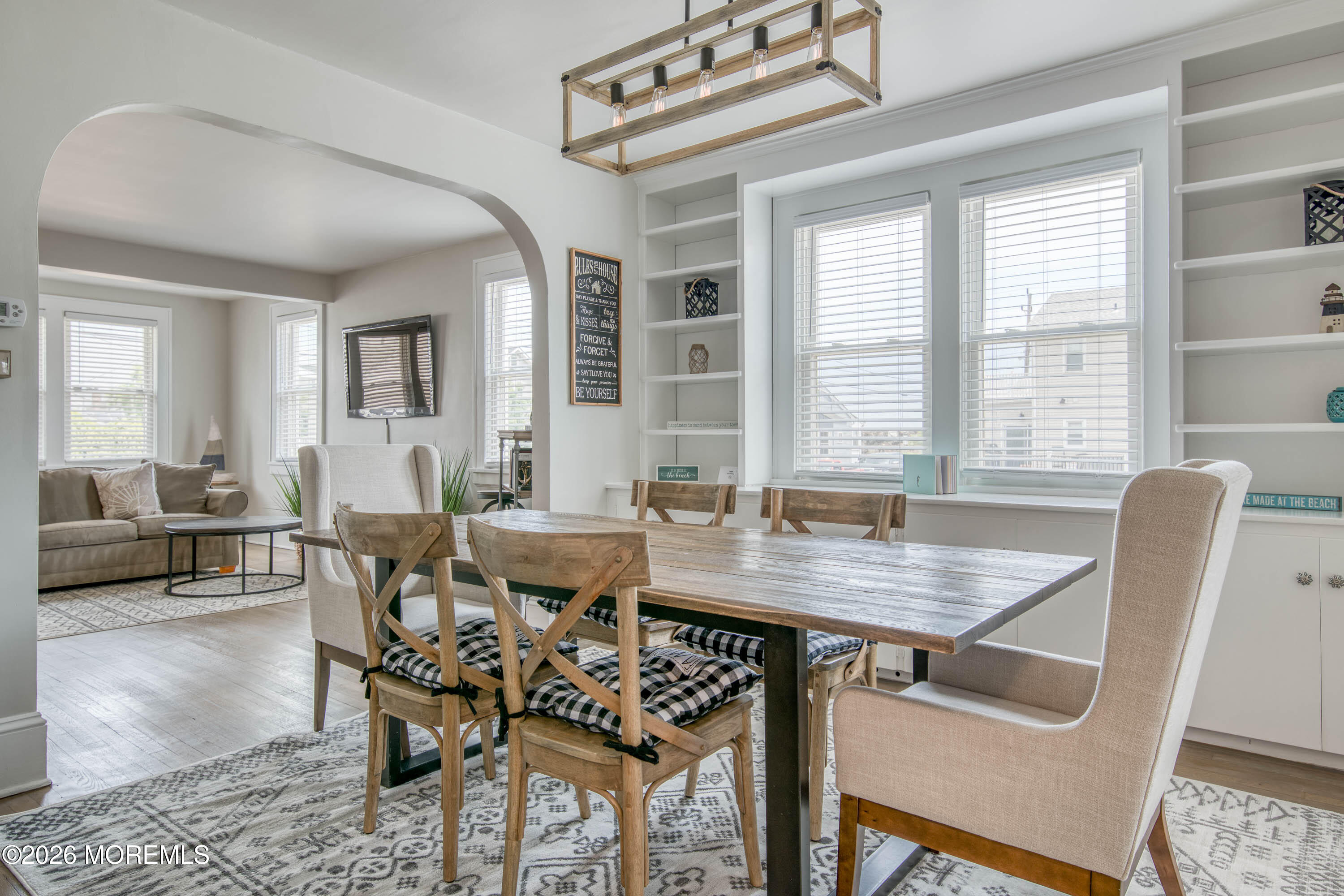 2 Via Ripa, Unit 1 Sea Bright, NJ 07760 - Photo 4 of 38 a view of a dining room with furniture and wooden floor