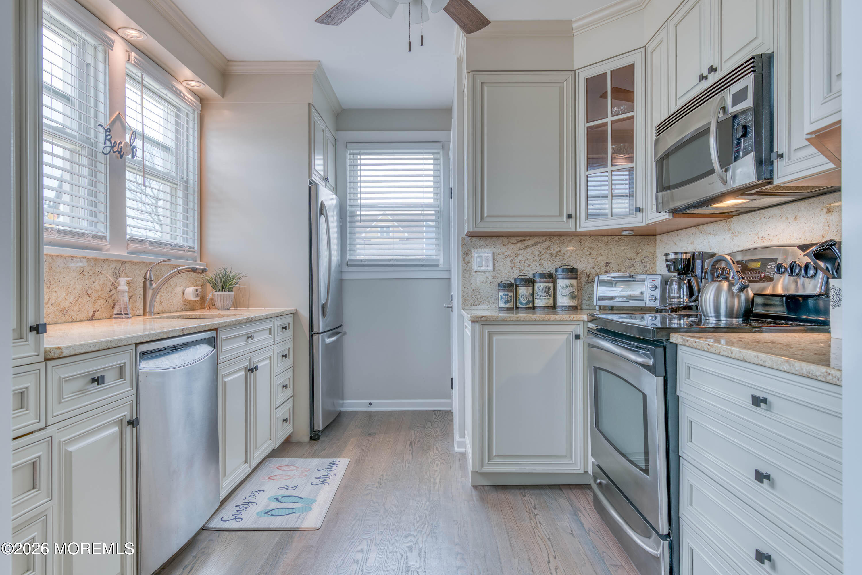 2 Via Ripa, Unit 1 Sea Bright, NJ 07760 - Photo 5 of 38 a kitchen with cabinets appliances and a window