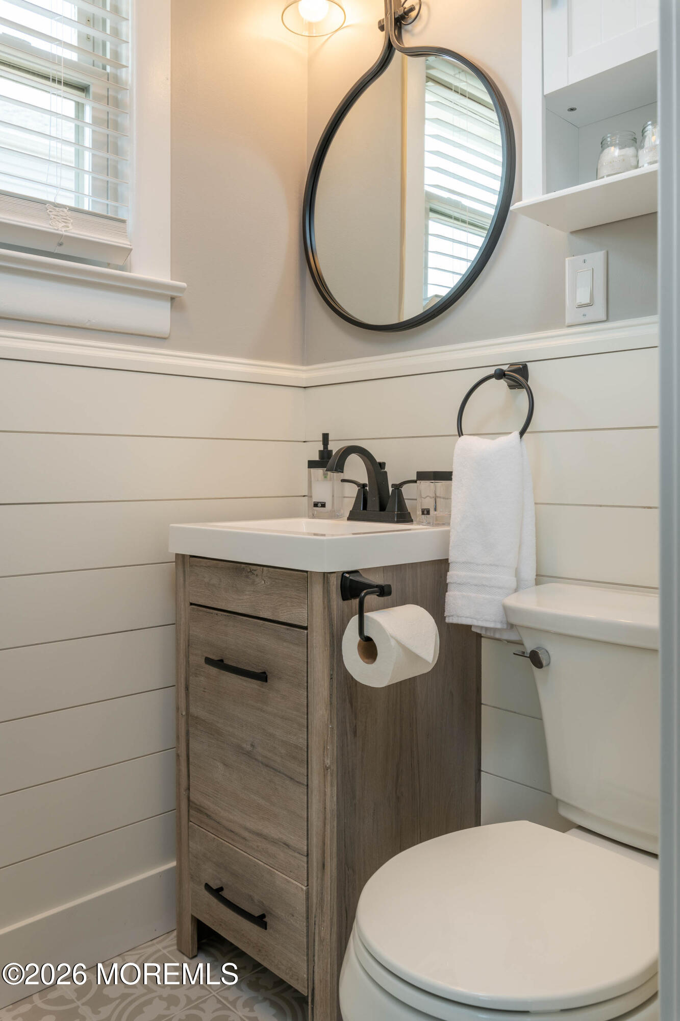 2 Via Ripa, Unit 1 Sea Bright, NJ 07760 - Photo 7 of 38 a bathroom with a toilet a sink and mirror