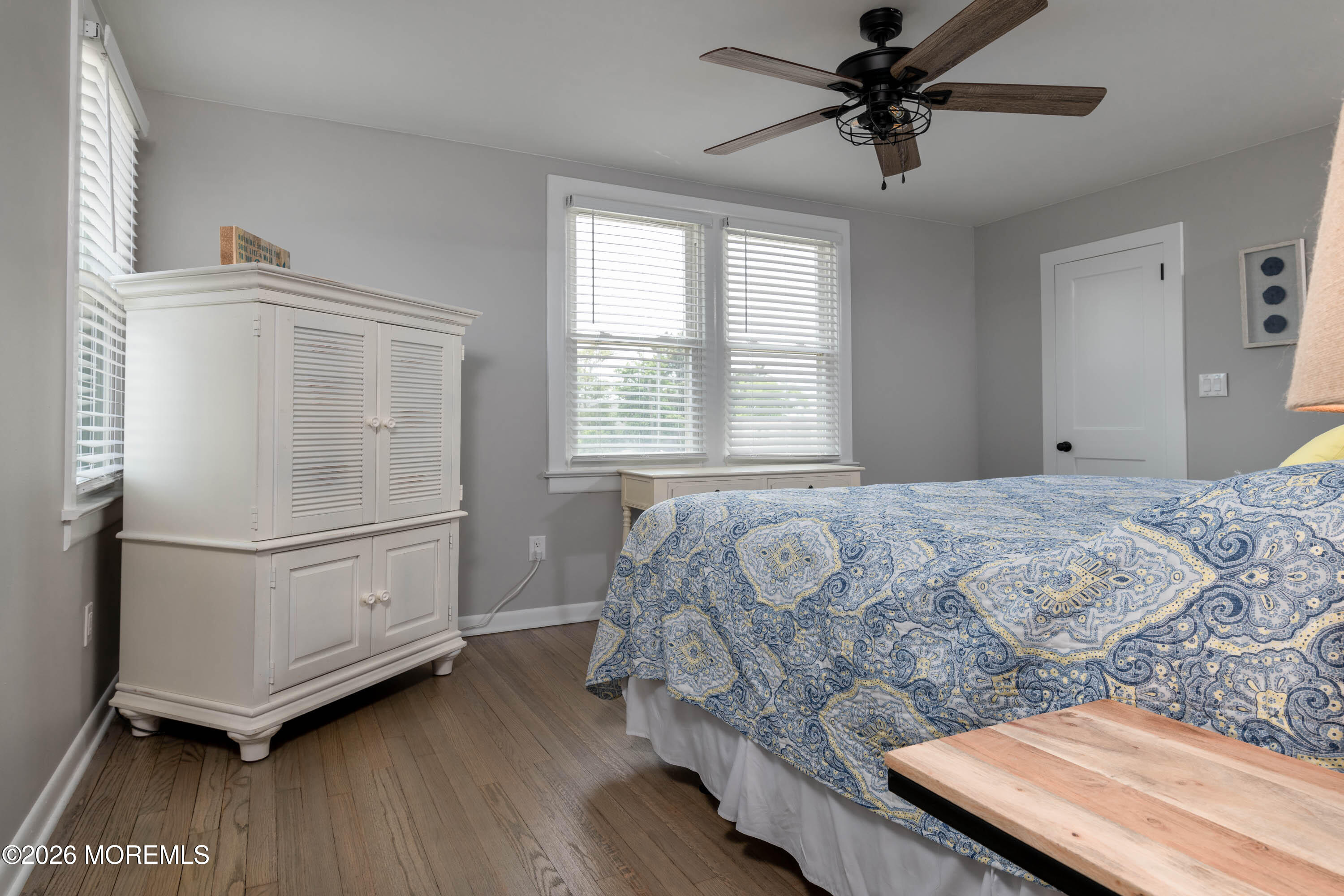 2 Via Ripa, Unit 1 Sea Bright, NJ 07760 - Photo 10 of 38 a bedroom with a bed and a ceiling fan