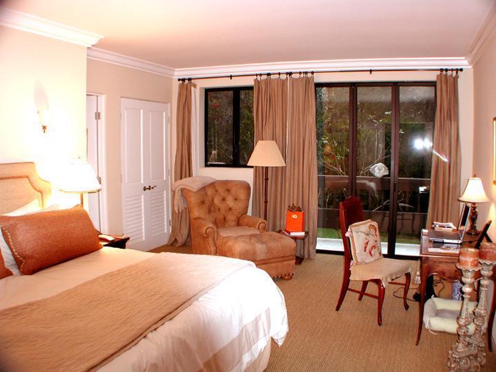 92 Seaview Drive Montecito, CA 93108 - Photo 19 of 27 a bedroom with a bed a table and chair