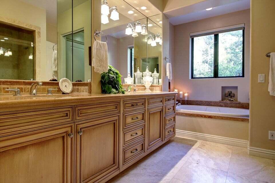 92 Seaview Drive Montecito, CA 93108 - Photo 22 of 27 a bathroom with a granite countertop sink and a large mirror