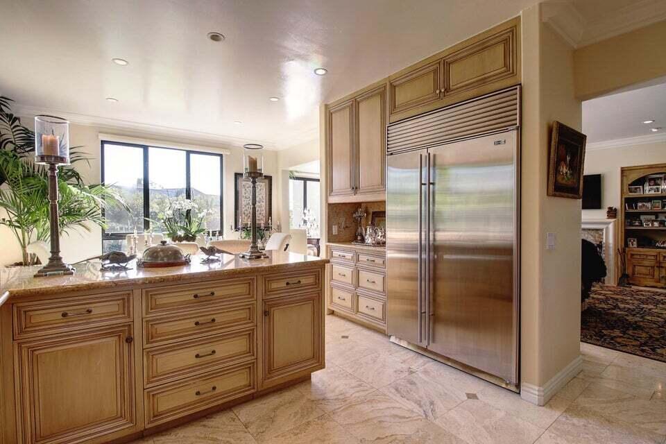 92 Seaview Drive Montecito, CA 93108 - Photo 23 of 27 a kitchen with a refrigerator and countertop sink