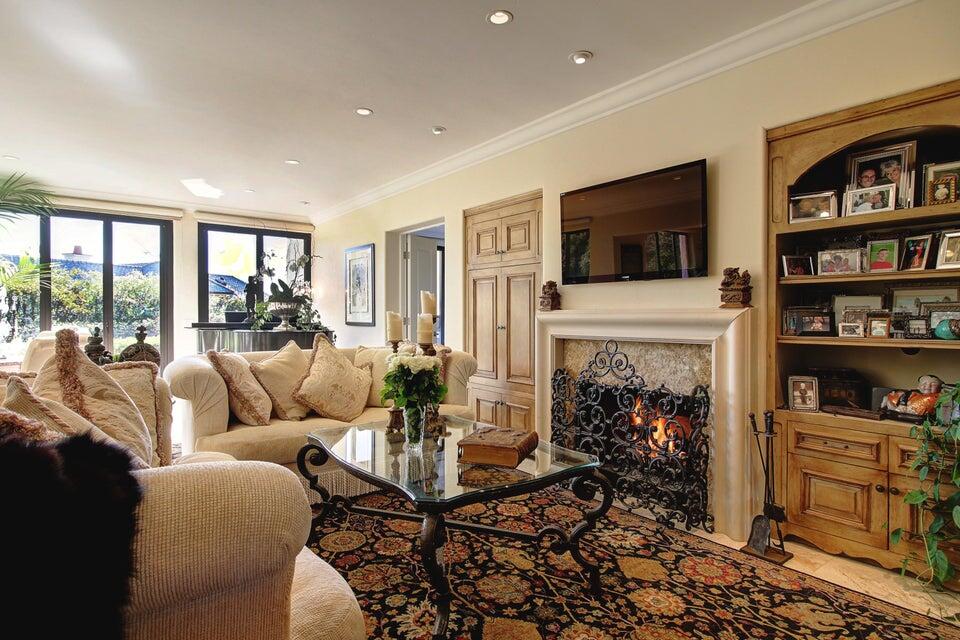92 Seaview Drive Montecito, CA 93108 - Photo 4 of 27 a living room with furniture a flat screen tv and a fireplace