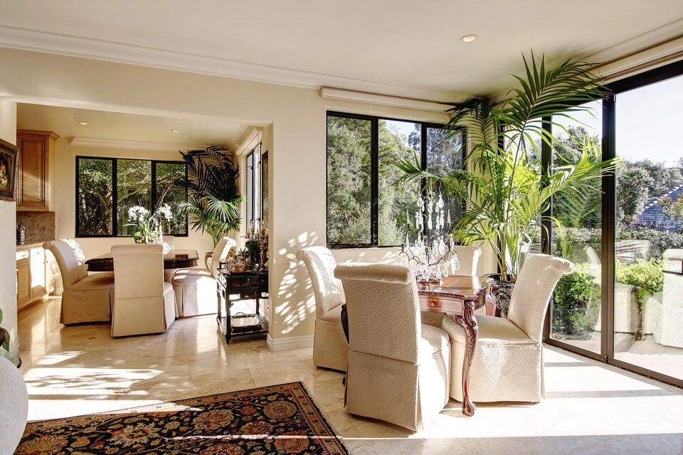 92 Seaview Drive Montecito, CA 93108 - Photo 6 of 27 a living room with patio furniture and a potted plant