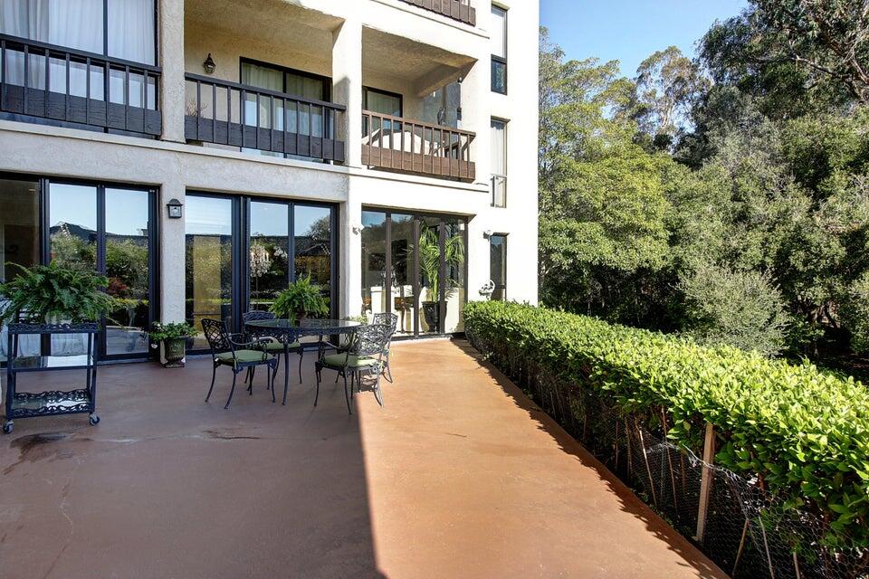 92 Seaview Drive Montecito, CA 93108 - Photo 8 of 27 a view of a patio with table and chairs and potted plants