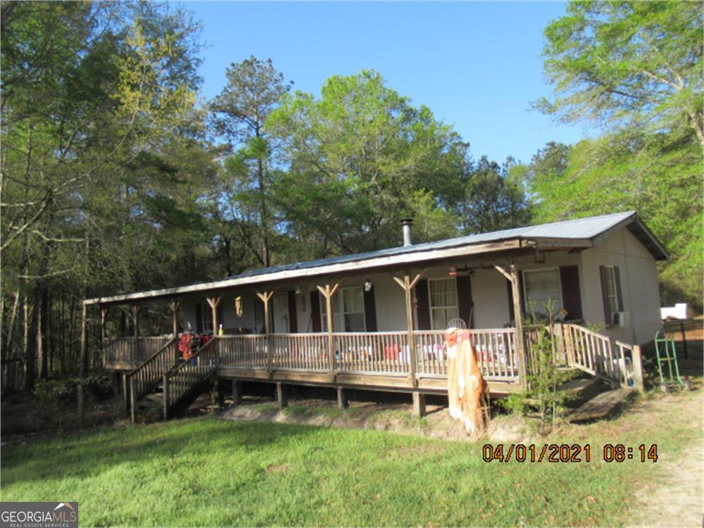 2635 Victoria Road Metter, GA 30439 - Photo 1 of 1 a backyard of a house with wooden floor and fence