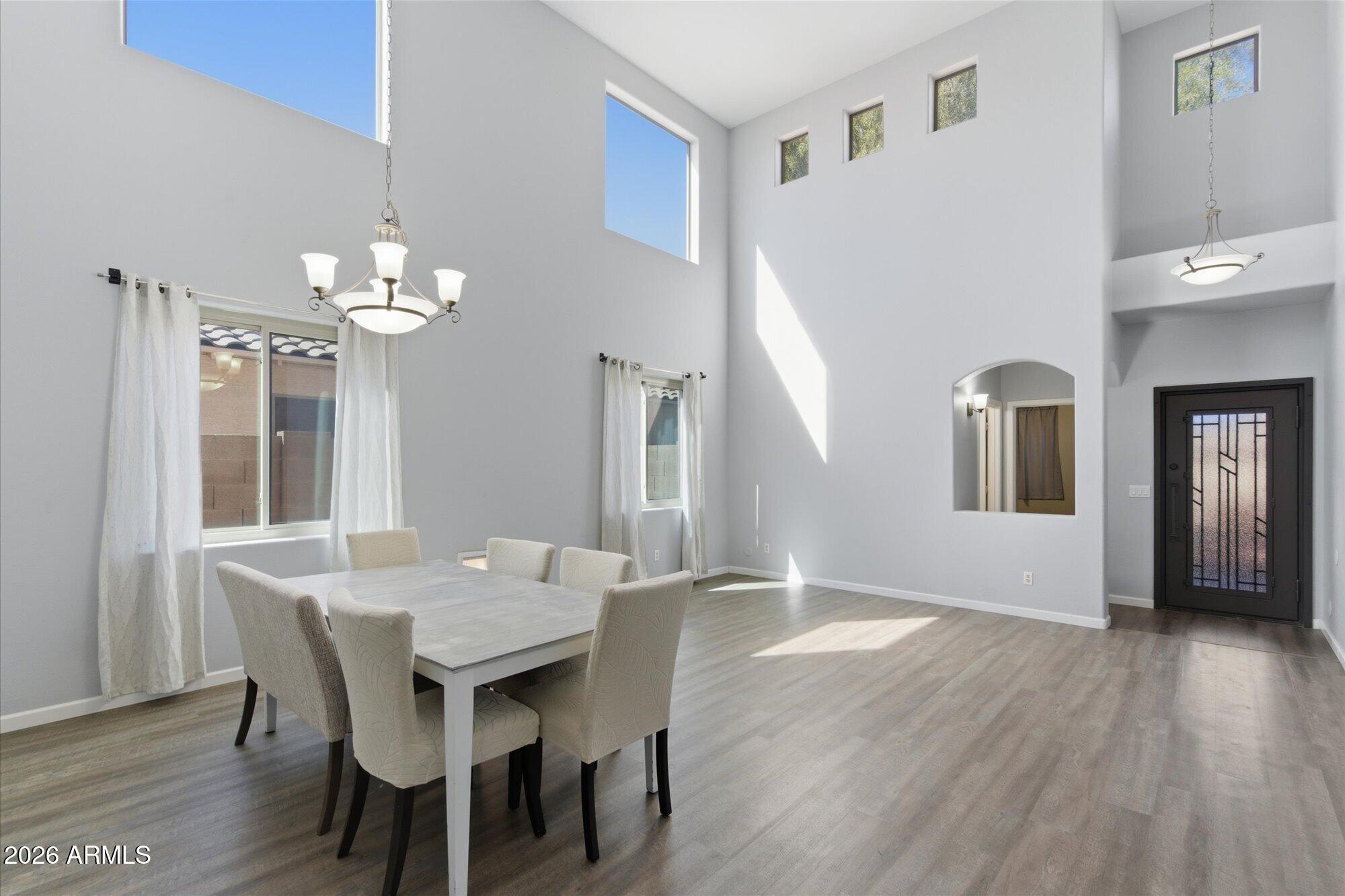 21915 Dietz Drive Maricopa, AZ 85138 - Photo 11 of 31 a view of a dining room with furniture and wooden floor