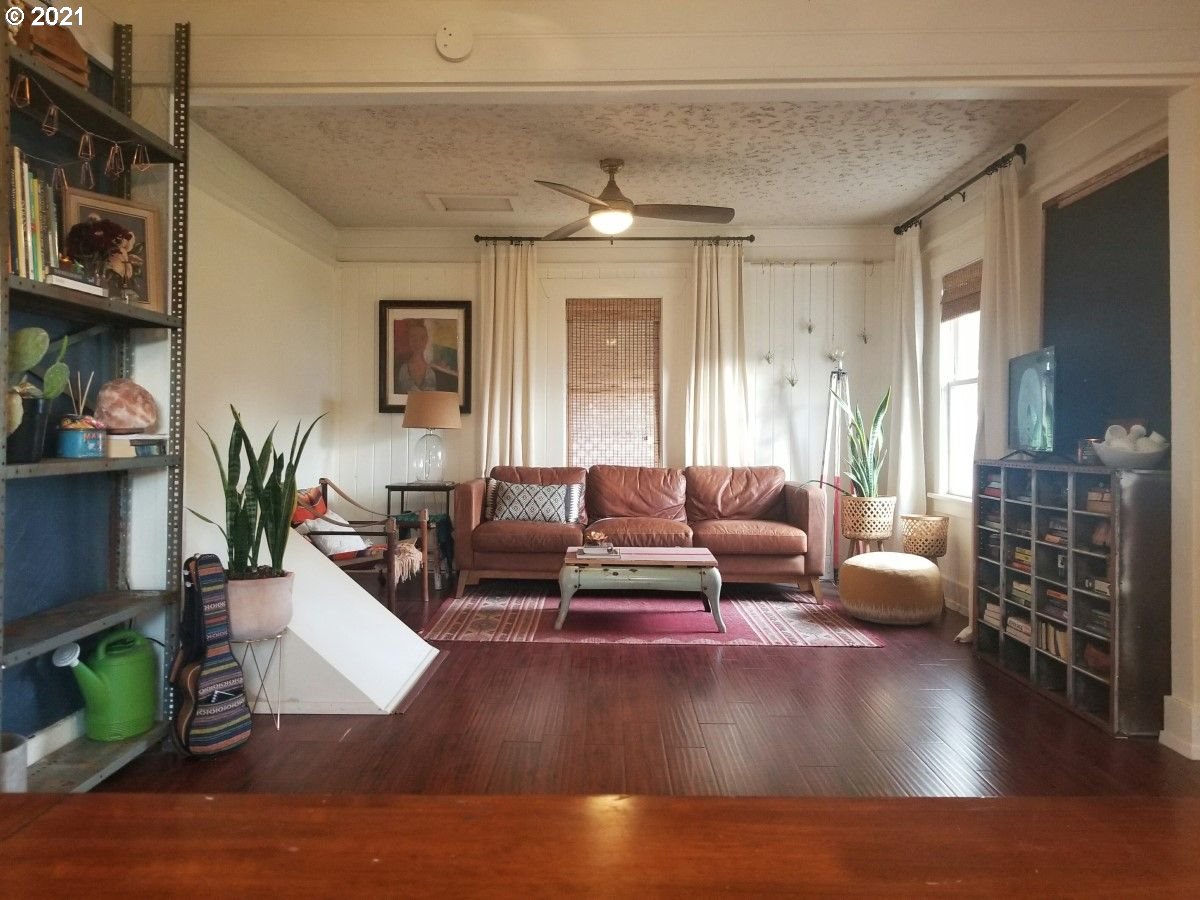 315 North 1st Avenue Ridgefield, WA 98642 - Photo 2 of 17 a living room with furniture and a hard wood floor