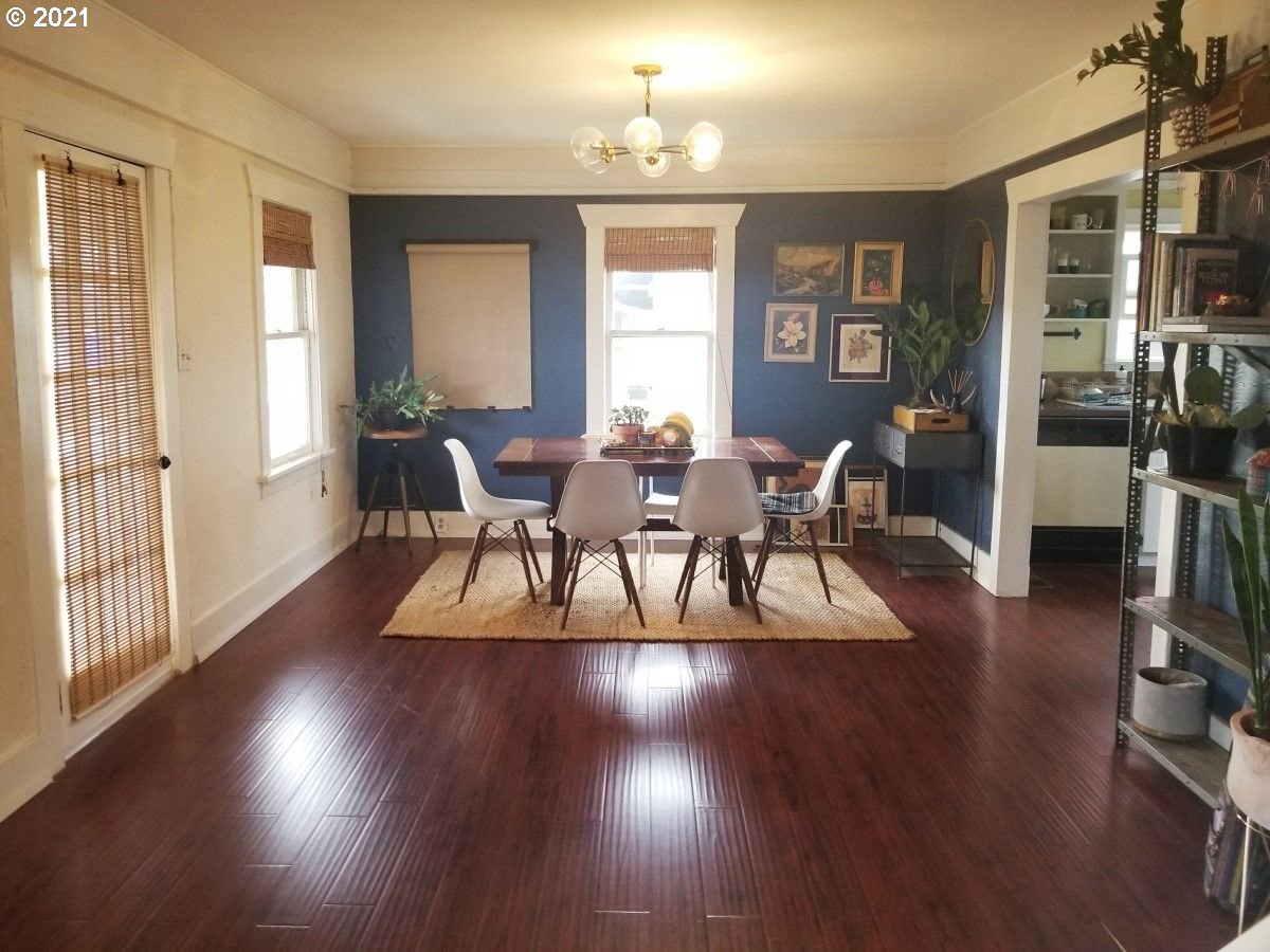 315 North 1st Avenue Ridgefield, WA 98642 - Photo 3 of 17 a view of a dining room with furniture window and wooden floor