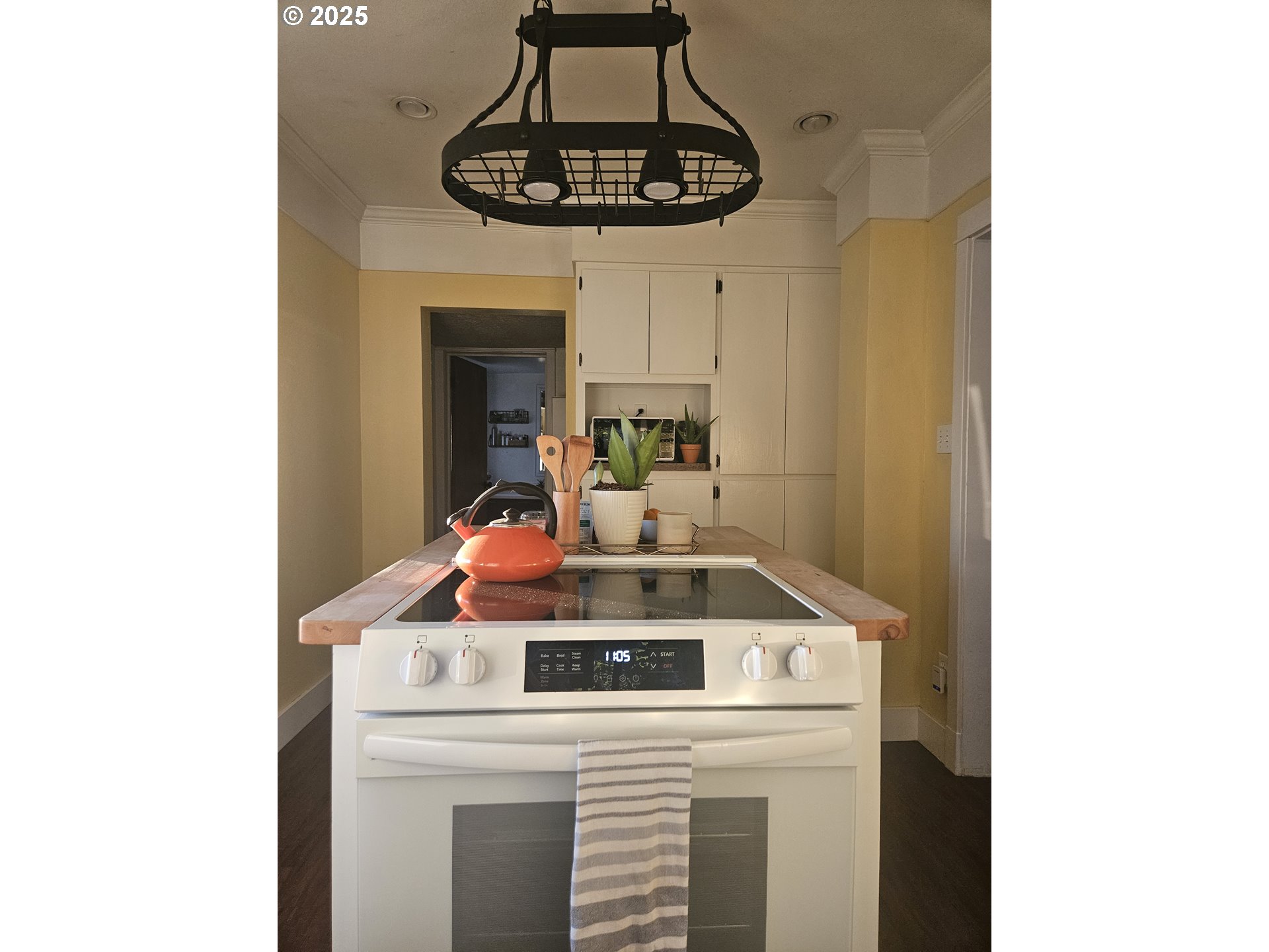 315 North 1st Avenue Ridgefield, WA 98642 - Photo 6 of 17 a kitchen with a stove and a microwave