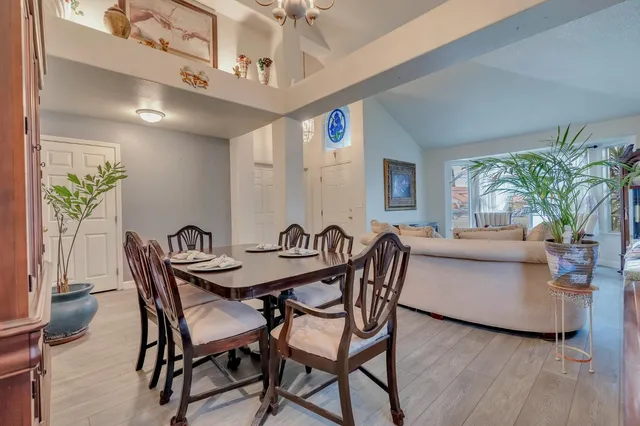 a kitchen with stainless steel appliances a sink a stove a microwave a center island and cabinets