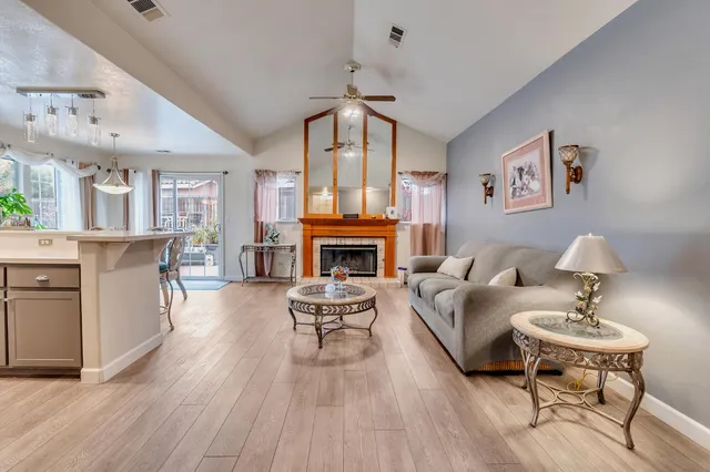 a bedroom with furniture and a wooden floor