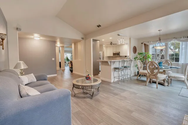a spacious bathroom with a granite countertop sink and a mirror
