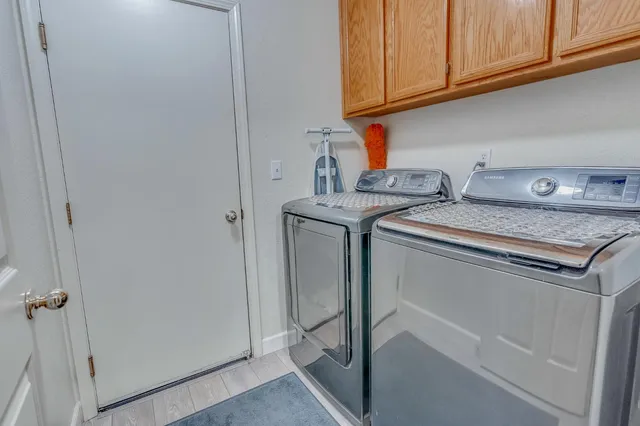 a view of a house with swimming pool and a yard