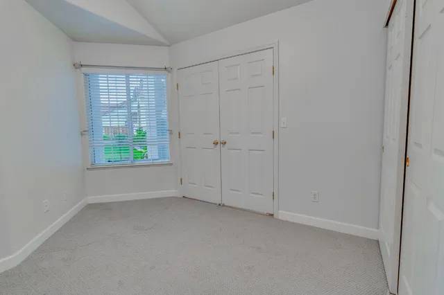 a view of a dining room with furniture and window