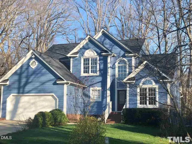 a front view of a house with yard