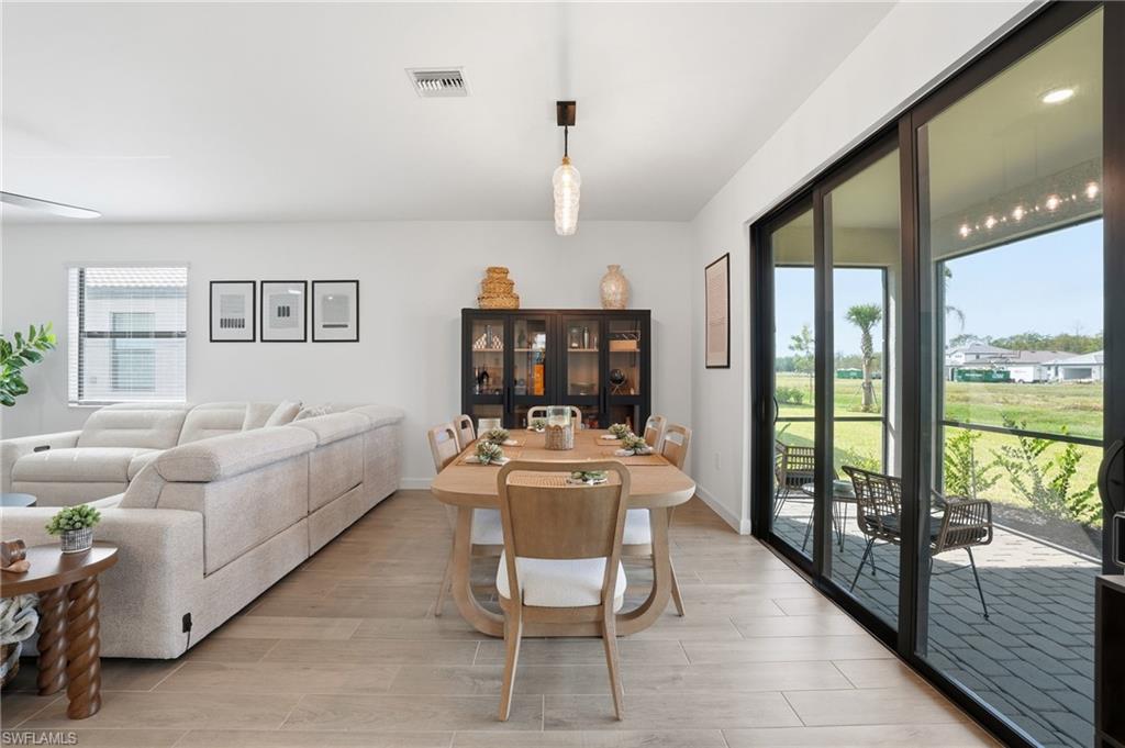 20428 Verawood Loop Estero, FL 33928 - Photo 13 of 50 Dining room featuring wood finish floors