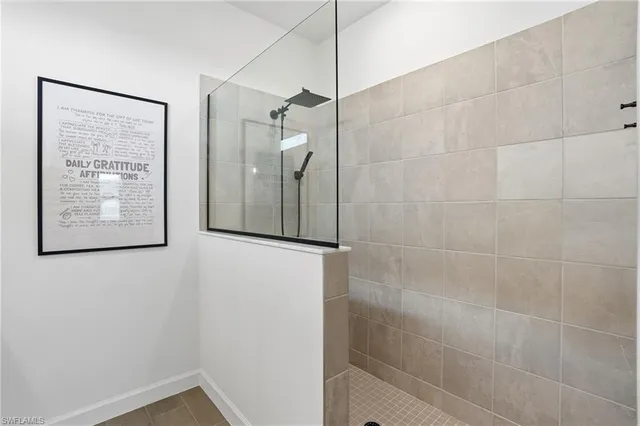 a bathroom with a shower and a window