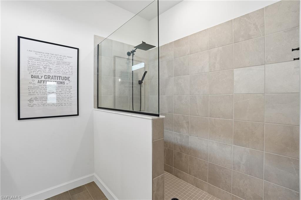 20428 Verawood Loop Estero, FL 33928 - Photo 20 of 50 Bathroom with a walk in shower and baseboards
