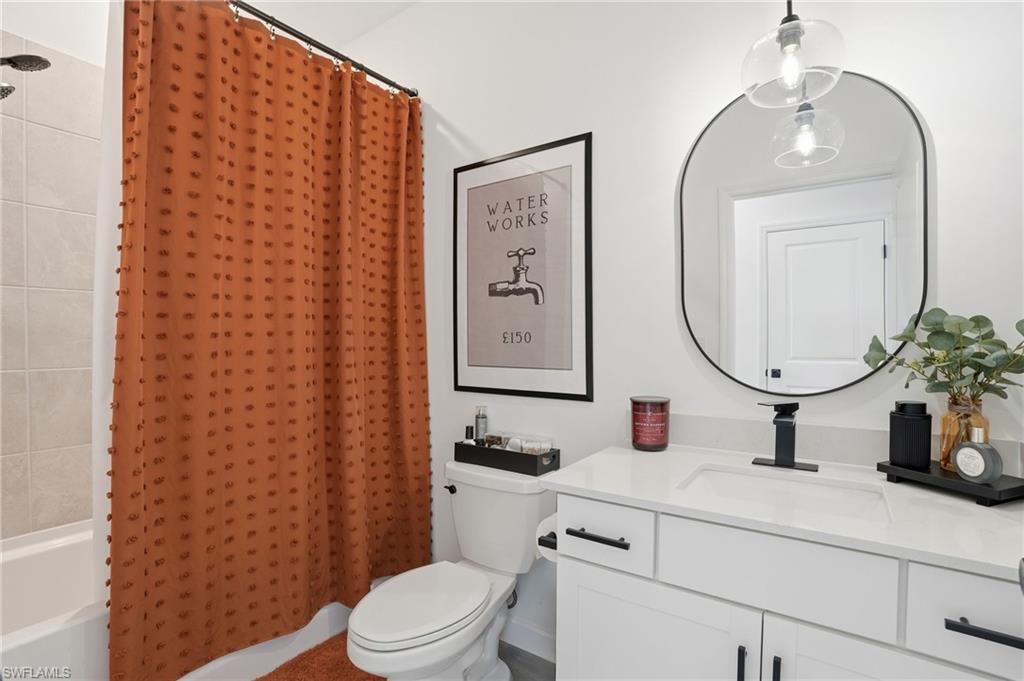 20428 Verawood Loop Estero, FL 33928 - Photo 26 of 50 Full bathroom with shower / bathtub combination with curtain and vanity