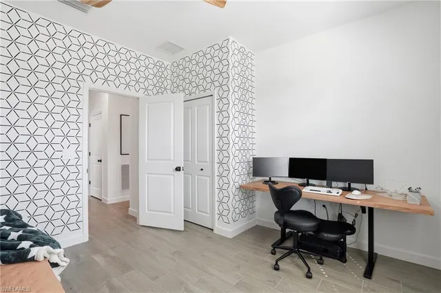 a view of a workspace with furniture