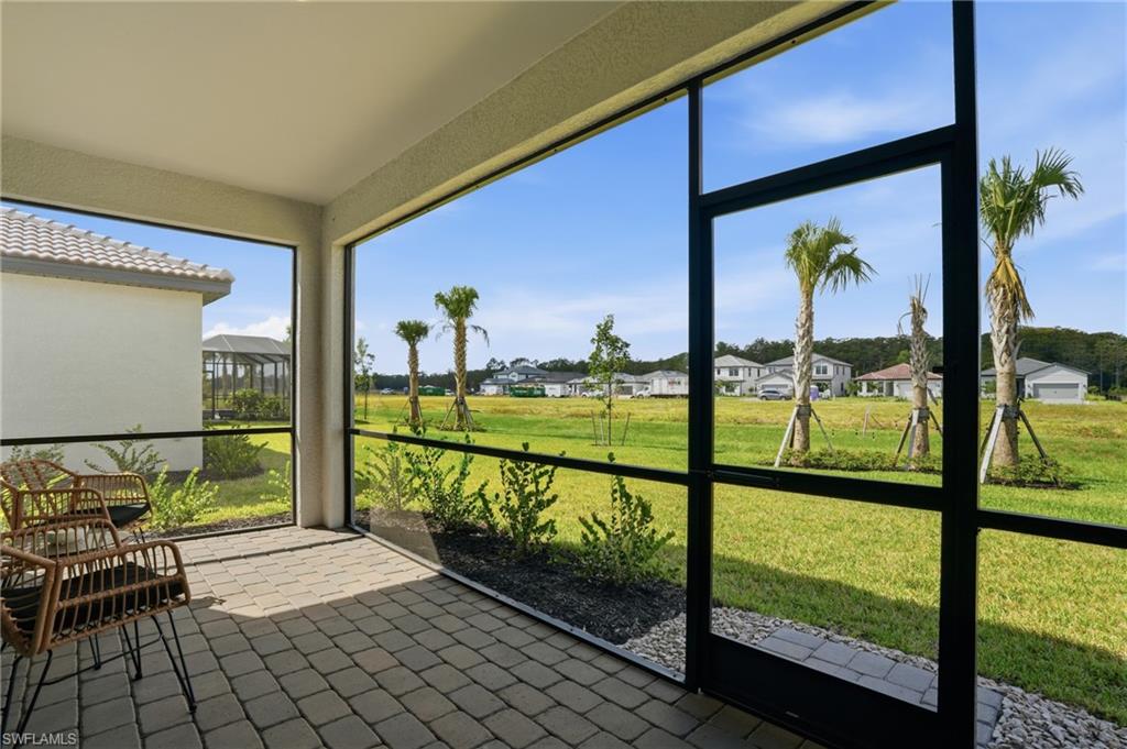 20428 Verawood Loop Estero, FL 33928 - Photo 32 of 50 Unfurnished sunroom with a residential view
