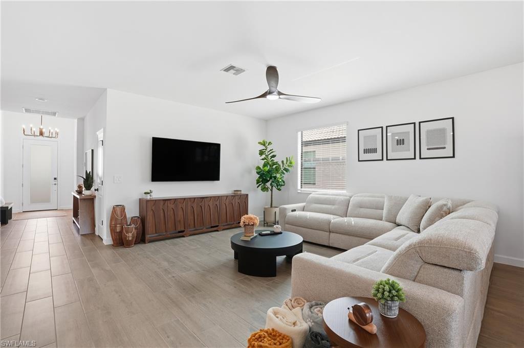 20428 Verawood Loop Estero, FL 33928 - Photo 6 of 50 Living area with wood finished floors and ceiling fan