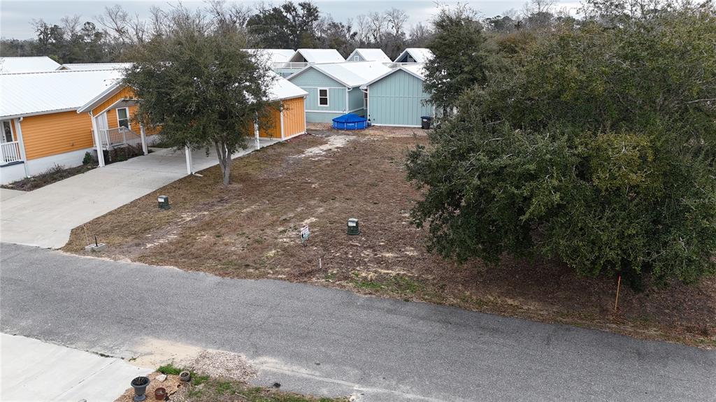 Tbd Southwest Tbd Sw 879th Street Steinhatchee, FL 32359 - Photo 13 of 17 a front view of a house with a yard and garage