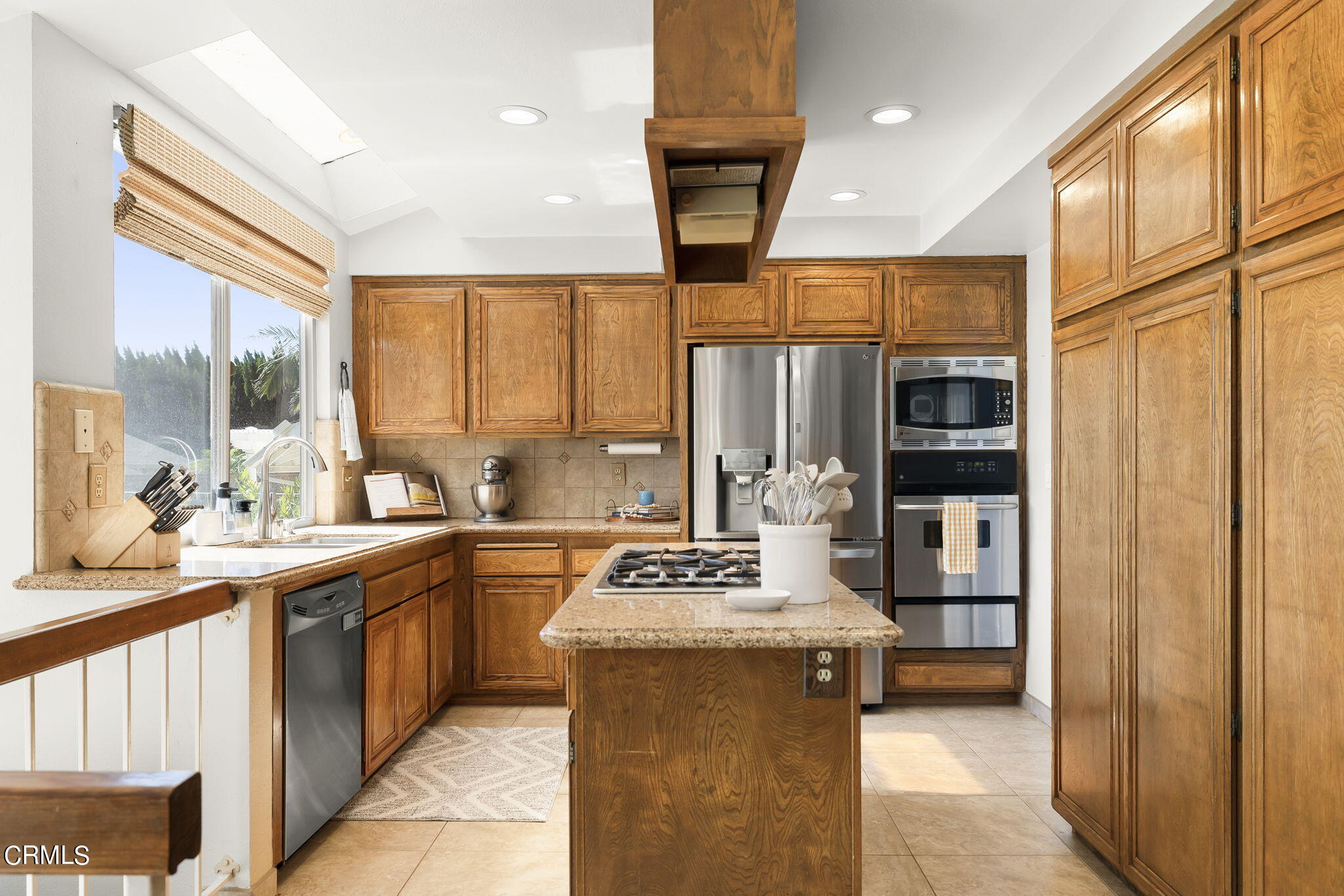 320 Fallen Leaf Avenue Camarillo, CA 93012 - Photo 13 of 49 a kitchen with a sink stove and cabinets