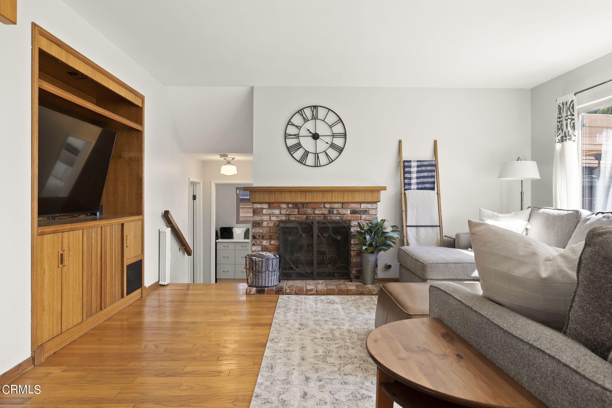 320 Fallen Leaf Avenue Camarillo, CA 93012 - Photo 15 of 49 a living room with furniture a flat screen tv and a fireplace