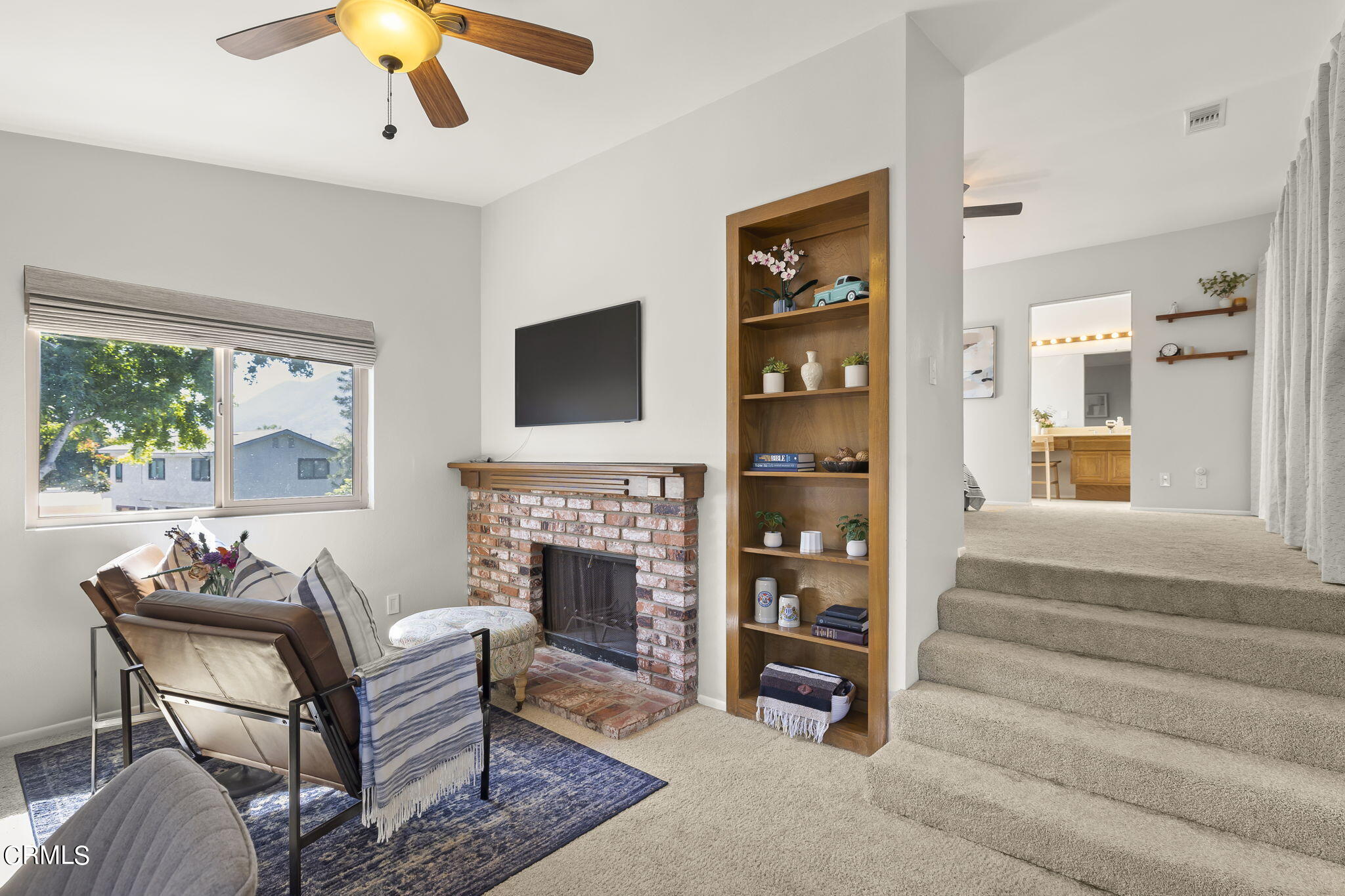 320 Fallen Leaf Avenue Camarillo, CA 93012 - Photo 21 of 49 a living room with furniture a fireplace and a flat screen tv