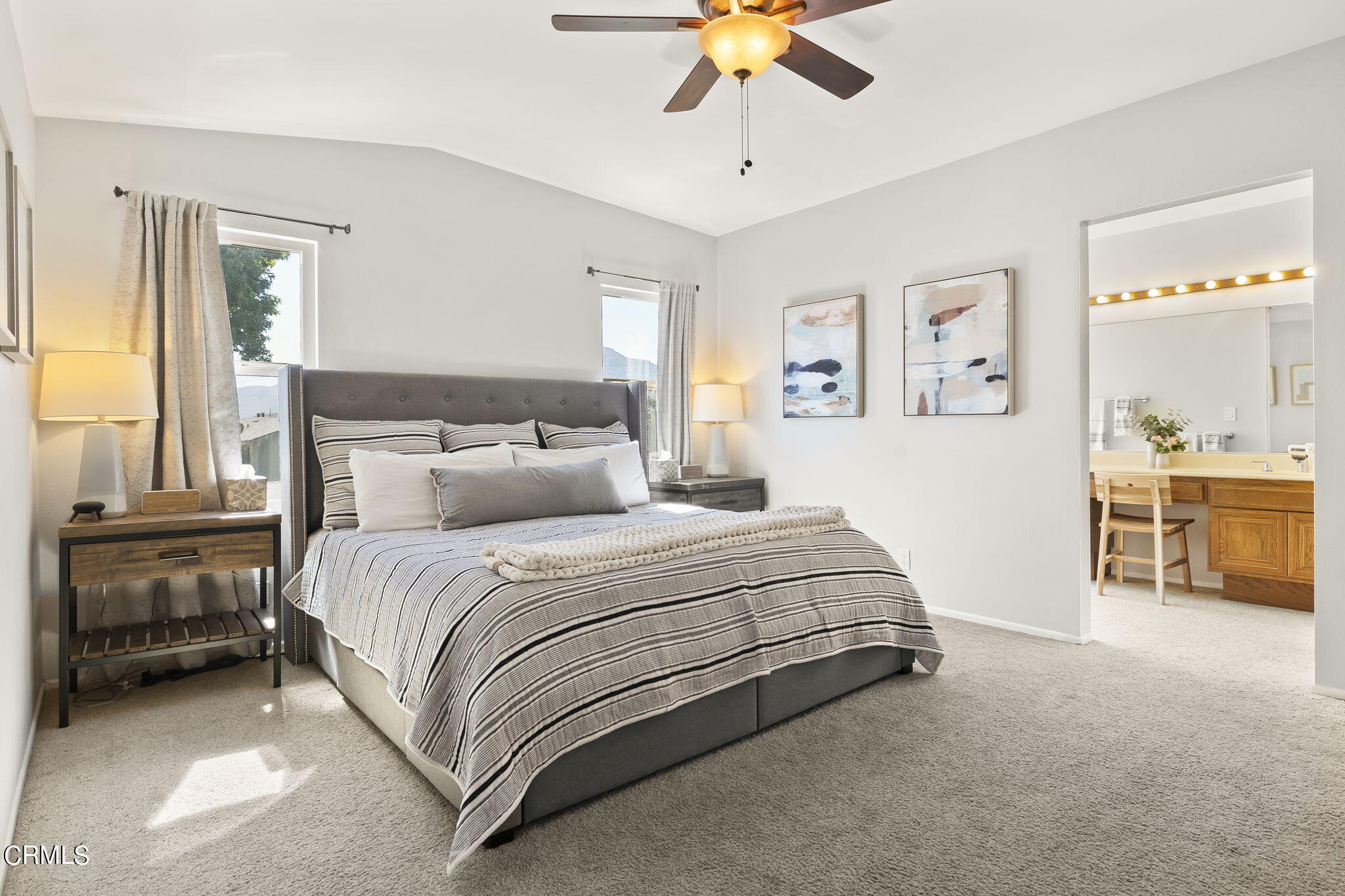 320 Fallen Leaf Avenue Camarillo, CA 93012 - Photo 24 of 49 a spacious bedroom with a bed and a chandelier
