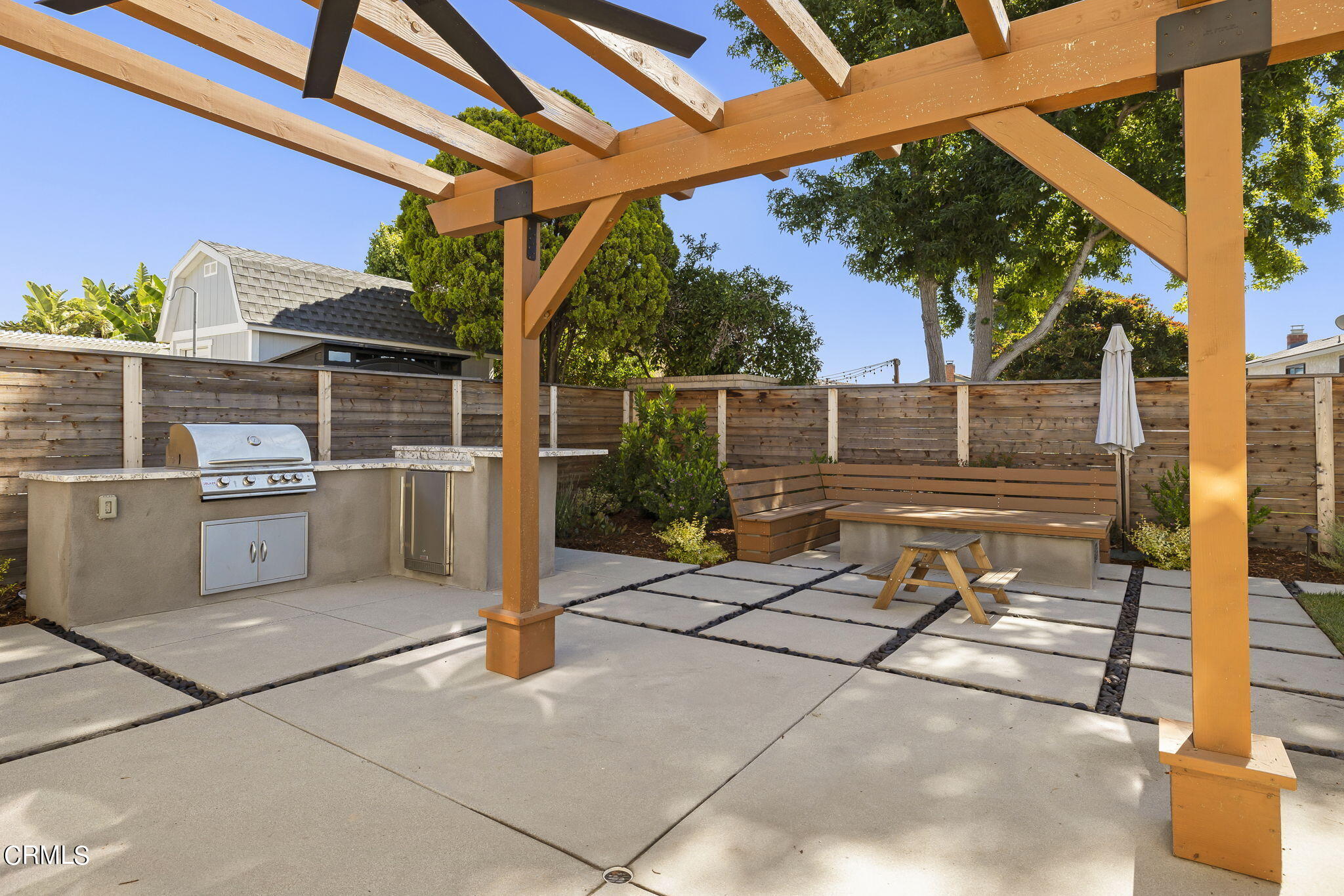 320 Fallen Leaf Avenue Camarillo, CA 93012 - Photo 38 of 49 a backyard of a house with barbeque oven table and chairs