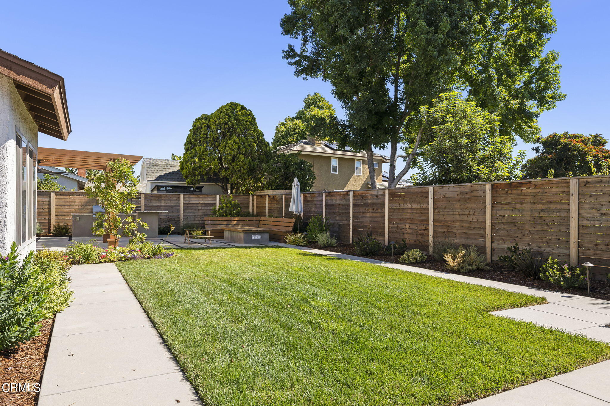 320 Fallen Leaf Avenue Camarillo, CA 93012 - Photo 43 of 49 a view of a backyard with brick wall and potted plants