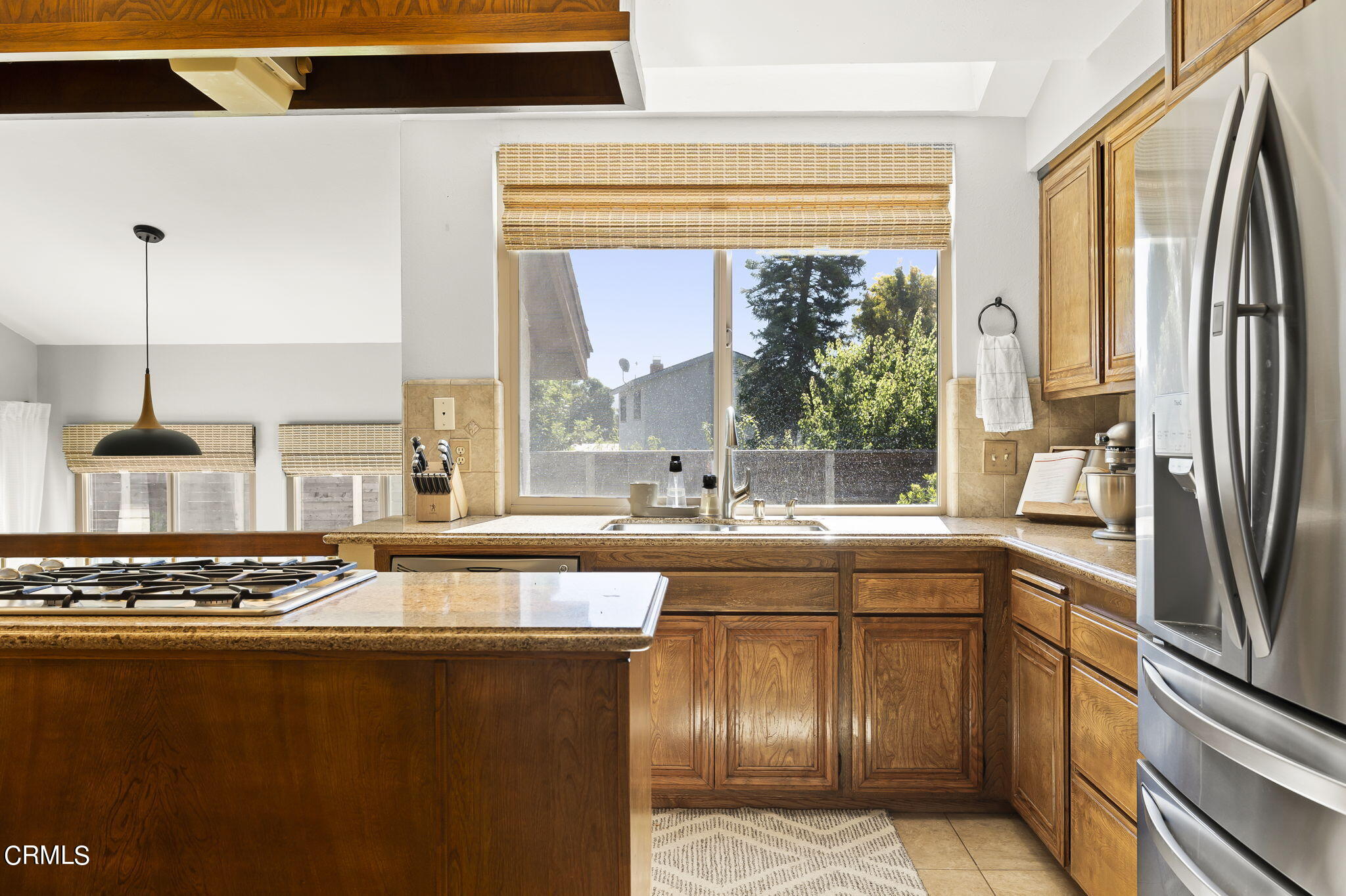 320 Fallen Leaf Avenue Camarillo, CA 93012 - Photo 10 of 49 a kitchen with stainless steel appliances granite countertop a sink stove and refrigerator
