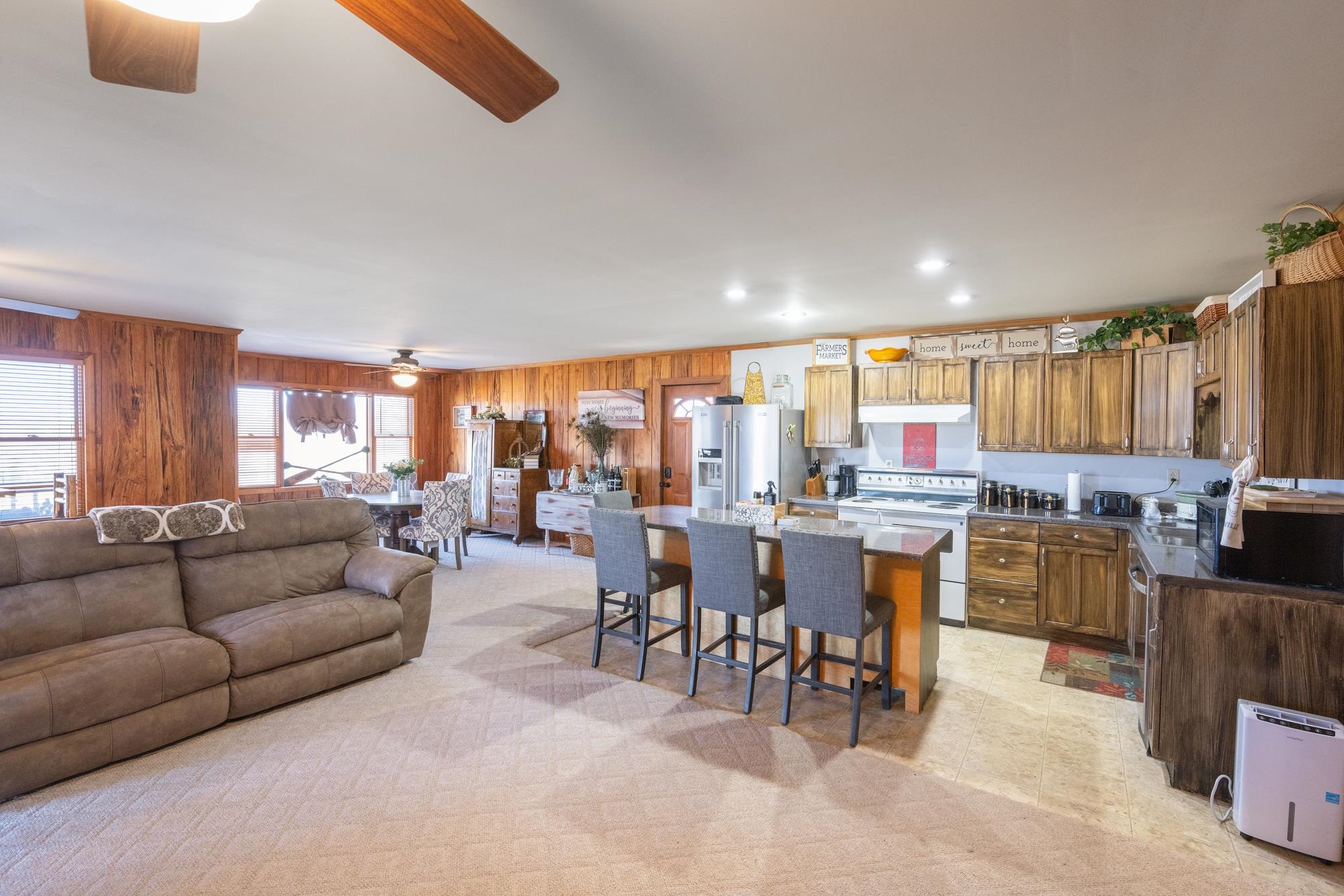 982 Lost Creek Boat Dock Road Decaturville, TN 38329 - Photo 31 of 31 a living room with lots of furniture and view kitchen