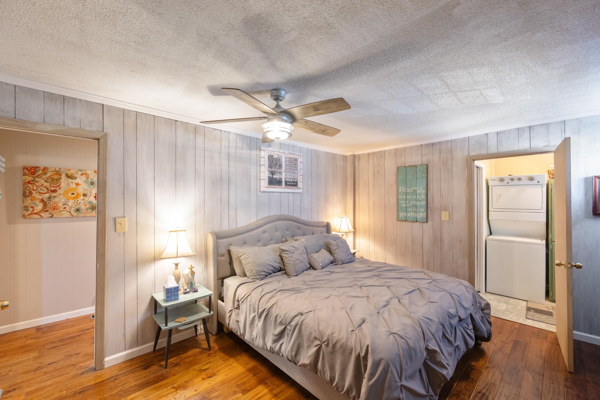 982 Lost Creek Boat Dock Road Decaturville, TN 38329 - Photo 16 of 31 a bedroom with a bed and a table in it