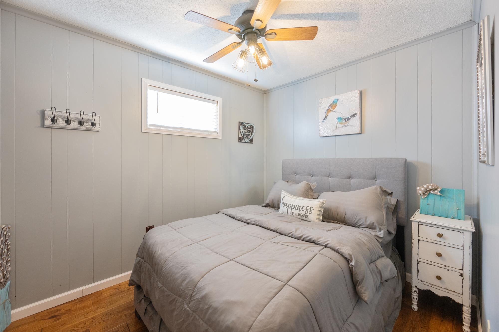 982 Lost Creek Boat Dock Road Decaturville, TN 38329 - Photo 22 of 31 a bedroom with a bed and a window