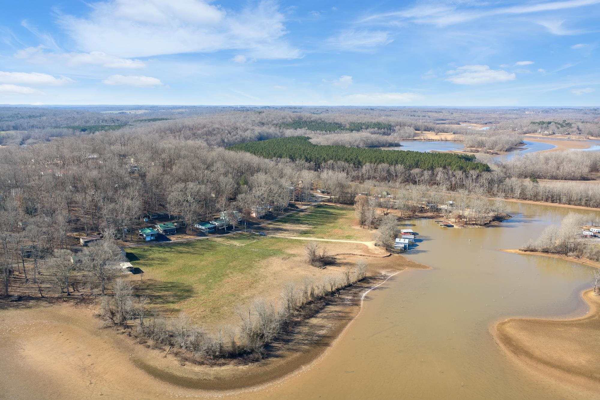 982 Lost Creek Boat Dock Road Decaturville, TN 38329 - Photo 26 of 31 a view of a swimming pool with a yard