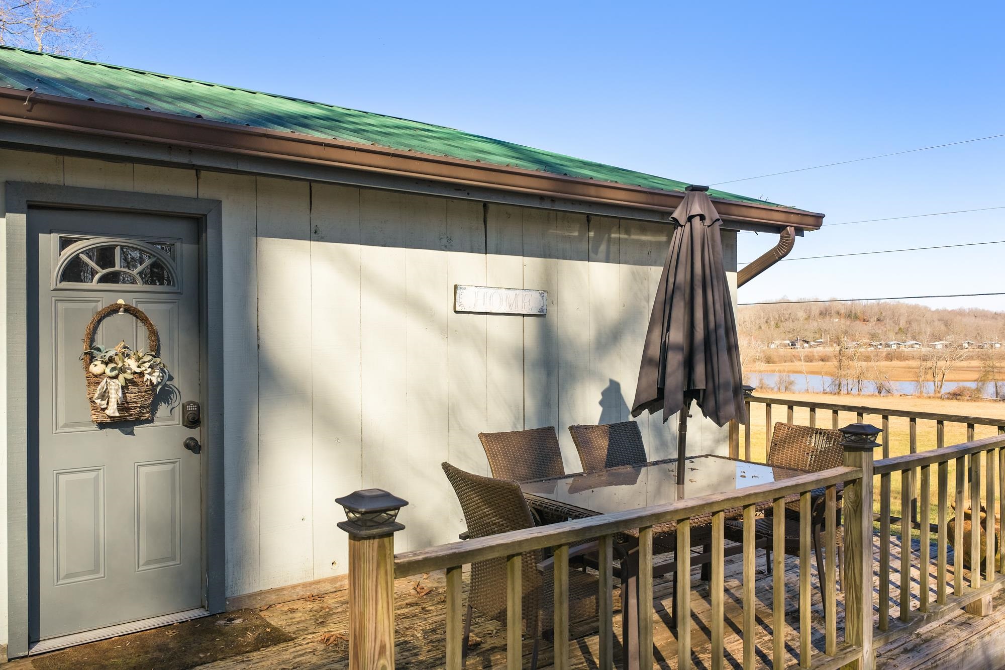 982 Lost Creek Boat Dock Road Decaturville, TN 38329 - Photo 5 of 31 a view of balcony and deck
