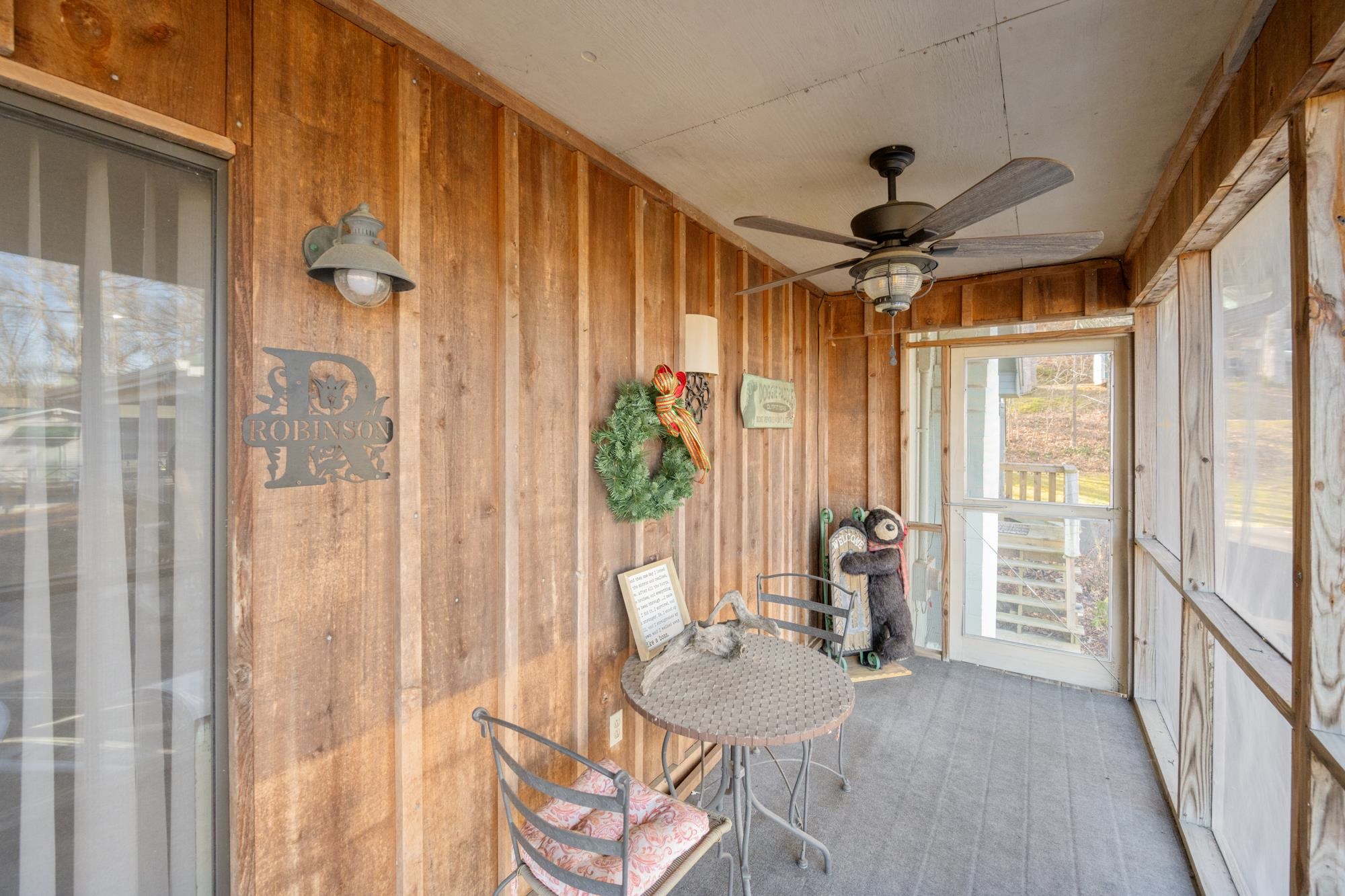 982 Lost Creek Boat Dock Road Decaturville, TN 38329 - Photo 8 of 31 a very nice looking room with a large window and chandelier