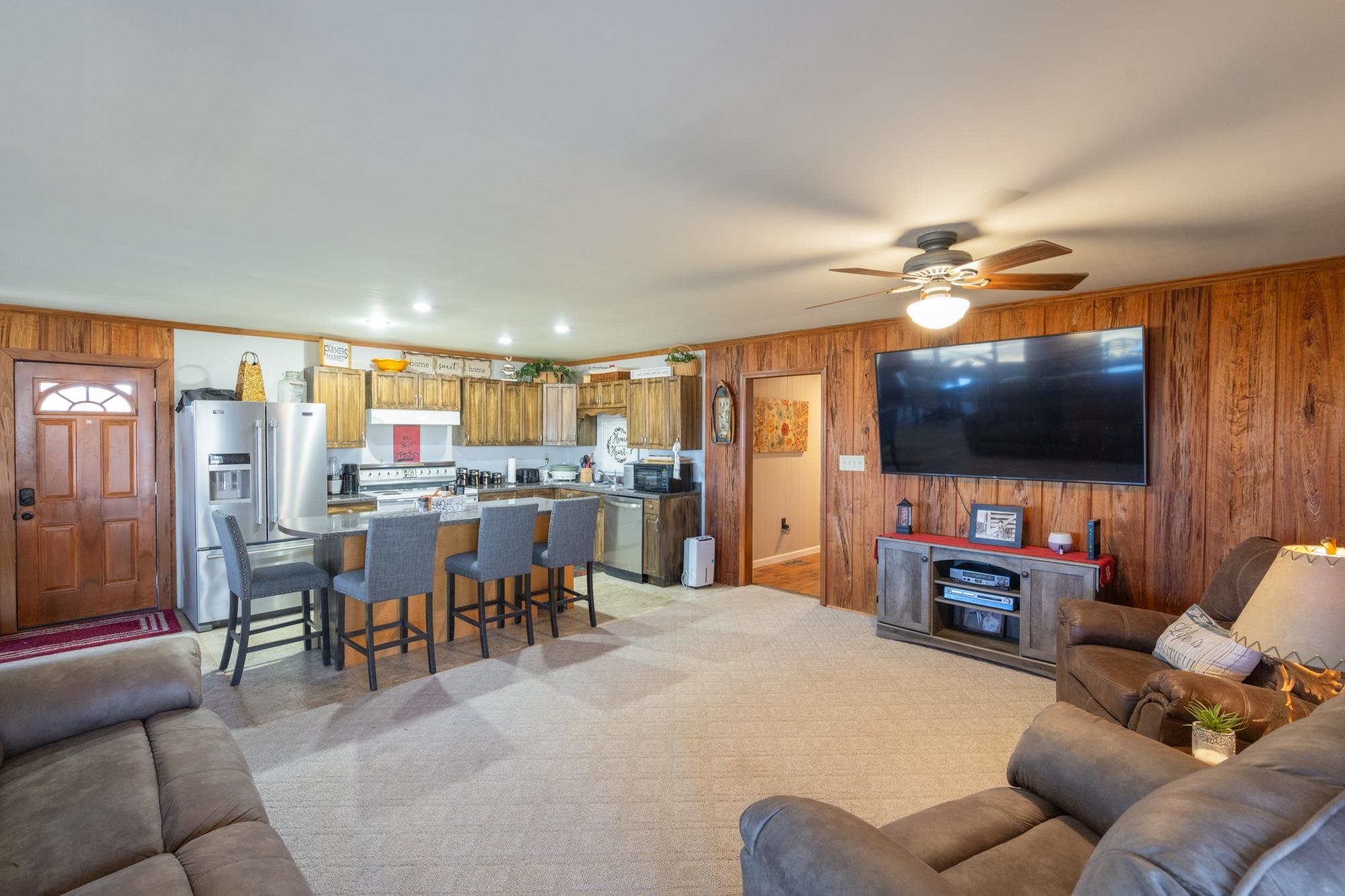 982 Lost Creek Boat Dock Road Decaturville, TN 38329 - Photo 10 of 31 a living room with furniture and a flat screen tv
