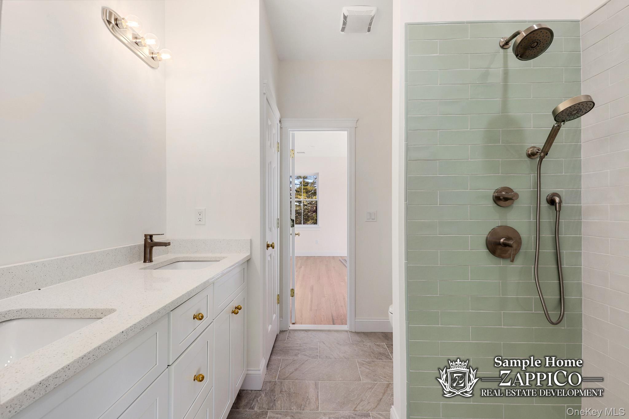 29 Gracemere Tarrytown, NY 10591 - Photo 12 of 16 a bathroom with a granite countertop sink a mirror and a shower