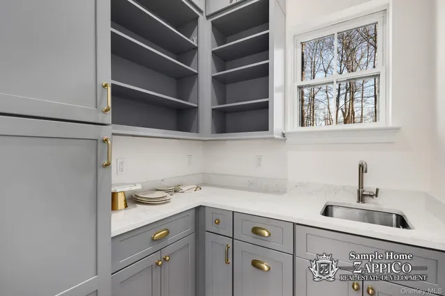 a kitchen with a sink and cabinets