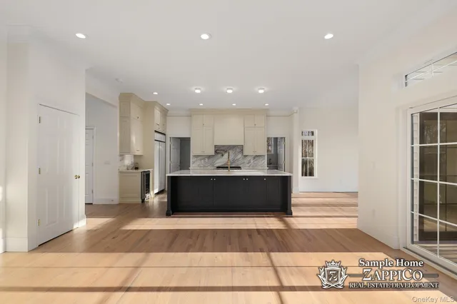 a living room with a couch and a rug