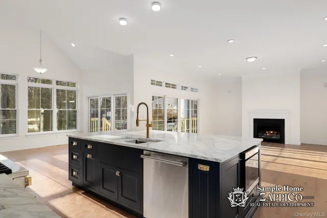 a kitchen with a sink stainless steel appliances and cabinets