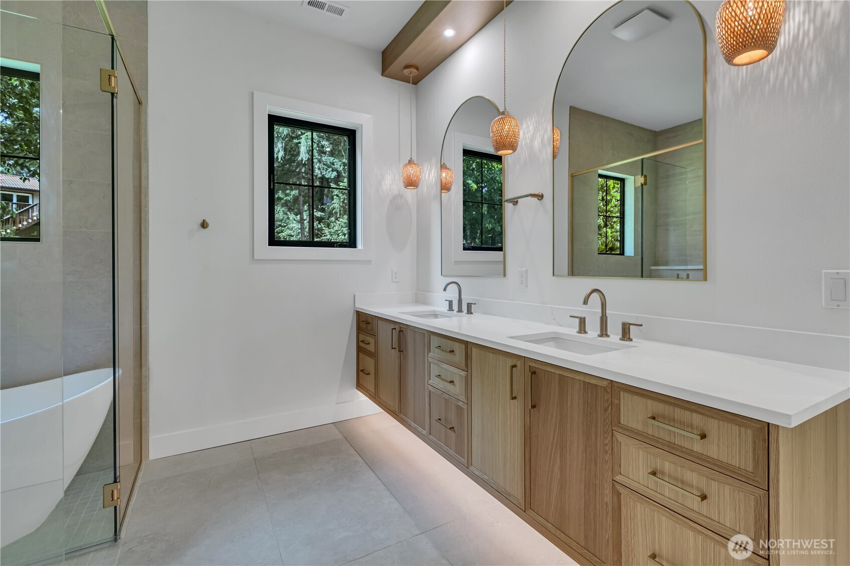 6709 254th Street East Graham, WA 98338 - Photo 20 of 40 a bathroom with a double vanity sink and a mirror