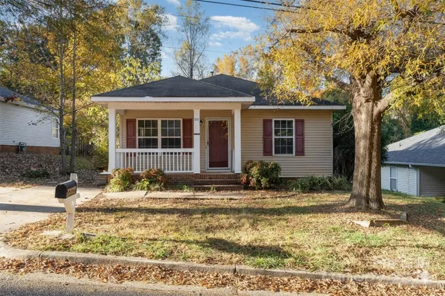a front view of a house with garden