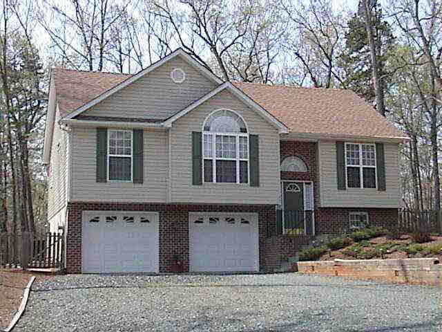 48 Amethyst Road Lake Monticello, VA 22963 - Photo 1 of 1 a front view of a house with a yard